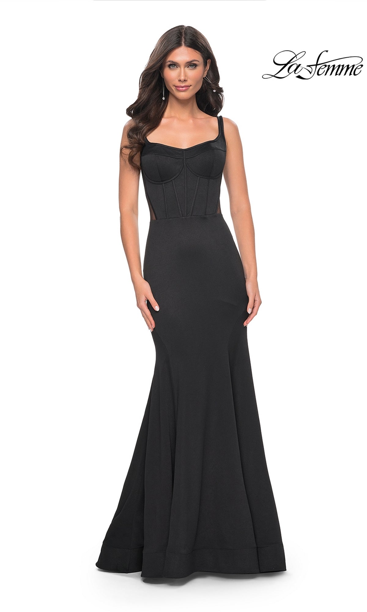 A woman models the La Femme Lace-Up Sheer Back Long Prom Dress 32268, featuring a corset-style bodice and wide shoulder straps, standing against a plain white background.
